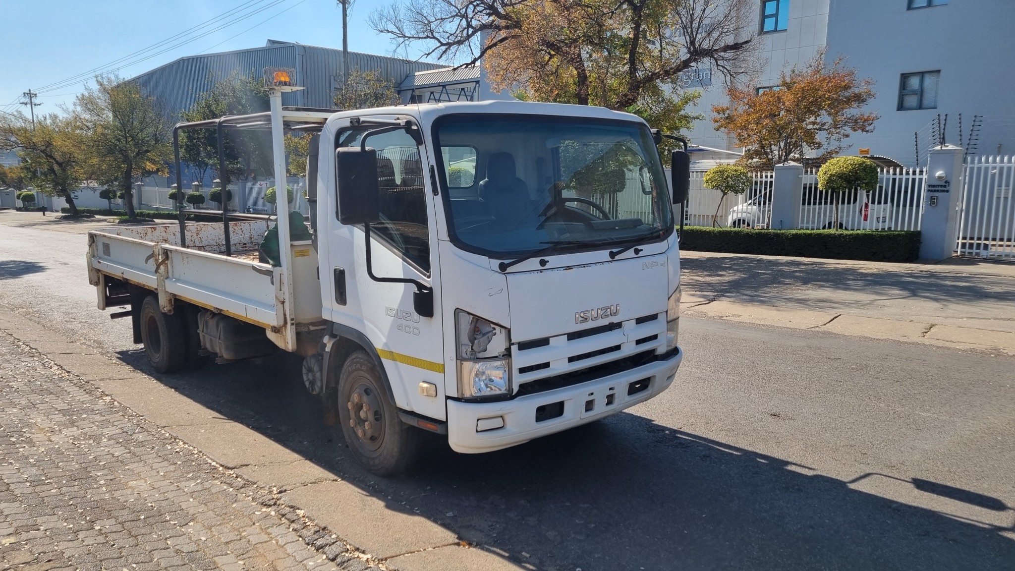 2012 ISUZU NPR400 4TON DROPSIDE BODY TRUCK - Image 1
